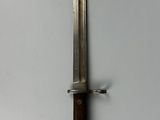 a small knife that is on a white surface