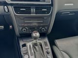 the interior of a car with a steering control and dashboard