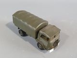 a toy truck that is sitting on a white surface