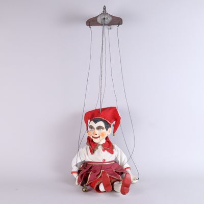 a puppet hanging from the ceiling of a room