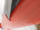 a close up of a red umbrella with a black handle