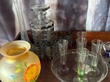 a tray with a lot of glass items on top of it