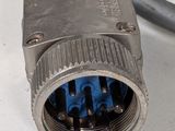 a close up of a metal connector on a white surface