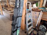 a bag and a pair of skis in a garage