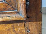 a close up of a wooden door with a metal handle