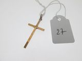 a close up of a cross and a price tag on a table