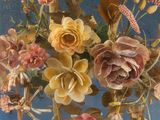 a vase with flowers in it sitting on a table