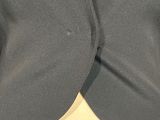 a close up of the back of a woman ' s blazer jacket