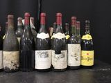 many bottles of wine lined up on a table