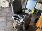 a barber chair in the middle of the room