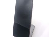 a cell phone that is sitting on top of a stand