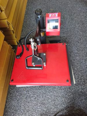 the machine is sitting on the floor next to the wall