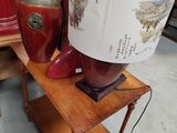 a lamp that is sitting on a table with a lamp shade on it