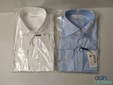 two men ' s shirts in plastic bags sitting on a table