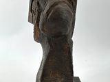 statue of a head of a man with a bow on a white background