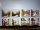 many old photos of people in the mountains on the wall