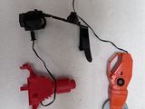 two tools that are laying on the floor next to each other