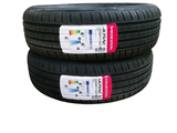 two tires are stacked on top of each other on a white background