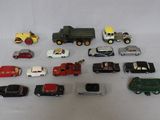 a lot of toy cars and trucks on a white surface
