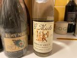 a bottle of wine next to a bottle of wine on a counter