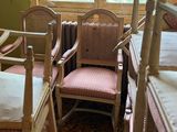 a lot of chairs and bunk beds in this room