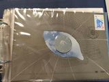 a binder with a picture of a clock inside of it