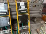 two carts that are next to each other in a warehouse