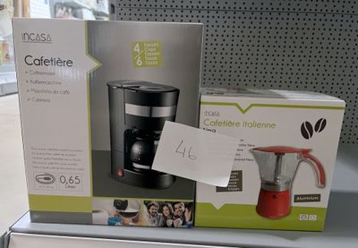 packaging for a coffee maker and a blender on display in a store