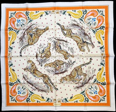 an orange and white banda with a picture of tigers on it