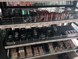 a lot of makeup products on display in a store