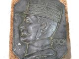 a plaque with a picture of a man wearing a hat