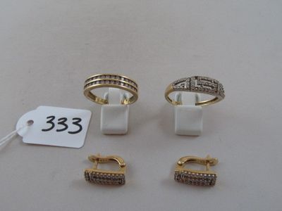 three pairs of rings and a pair of earrings