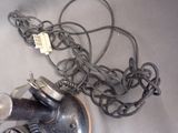 a sink with a faucet and a bunch of wires attached to it