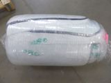 a bag of luggage wrapped in plastic on the floor