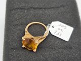 an image of a gold ring with a citrine stone
