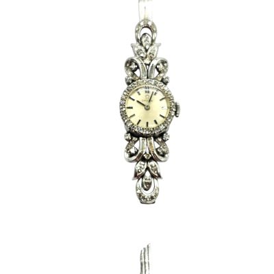 a silver clock hanging from a chain on a white background