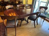 a table and chairs in a room with a large window