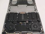 a close up of a laptop with a hard drive attached to it