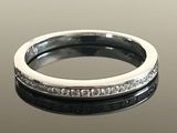a close up of a ring with diamonds on it