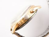 an image of a close up of a watch on a white surface