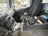 a view of a car ' s interior from the driver ' s seat
