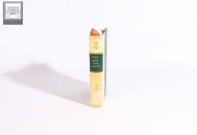 a small book that is sitting on a white surface