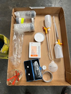 a box with various items in it on the floor