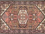 an old rug with a design on the middle of it