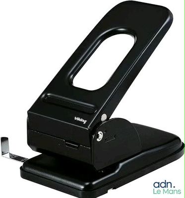 the stapler is black and has a hole in the middle of it