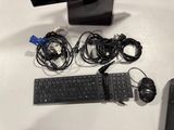 a keyboard, mouse, and mouse pad on a table