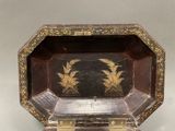 a small box with a design on the inside of it