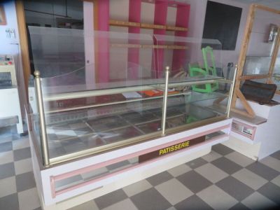 a glass display case in the middle of a kitchen