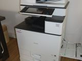 a white printer sitting on top of a black and white printer