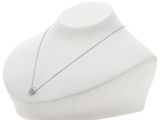 necklace on a mannequin with a diamond pendant on it